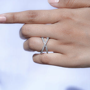 In finger front view of Round shape moissanite wedding ring in unique shape