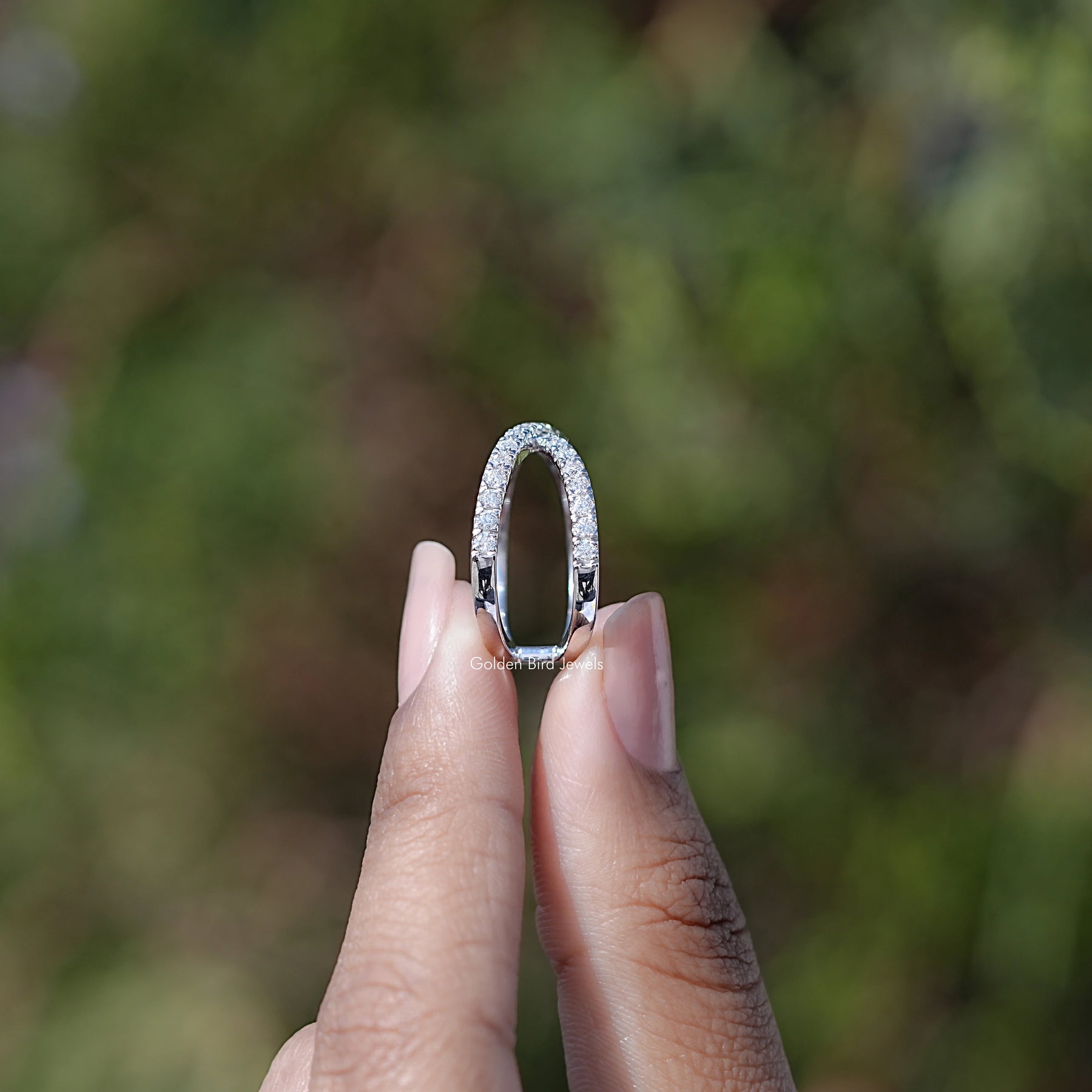 Side View of Engagement ring crafted Round Cut Moissanite
