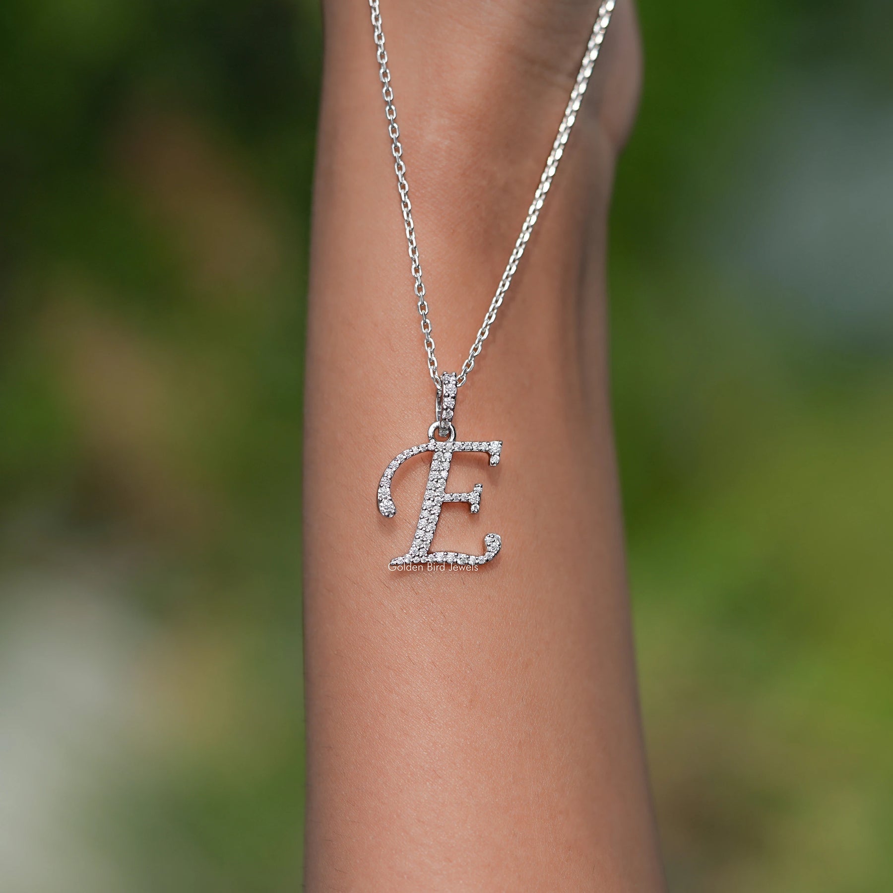 Close View Of E Letter moissanite pendant in Secure Setting 