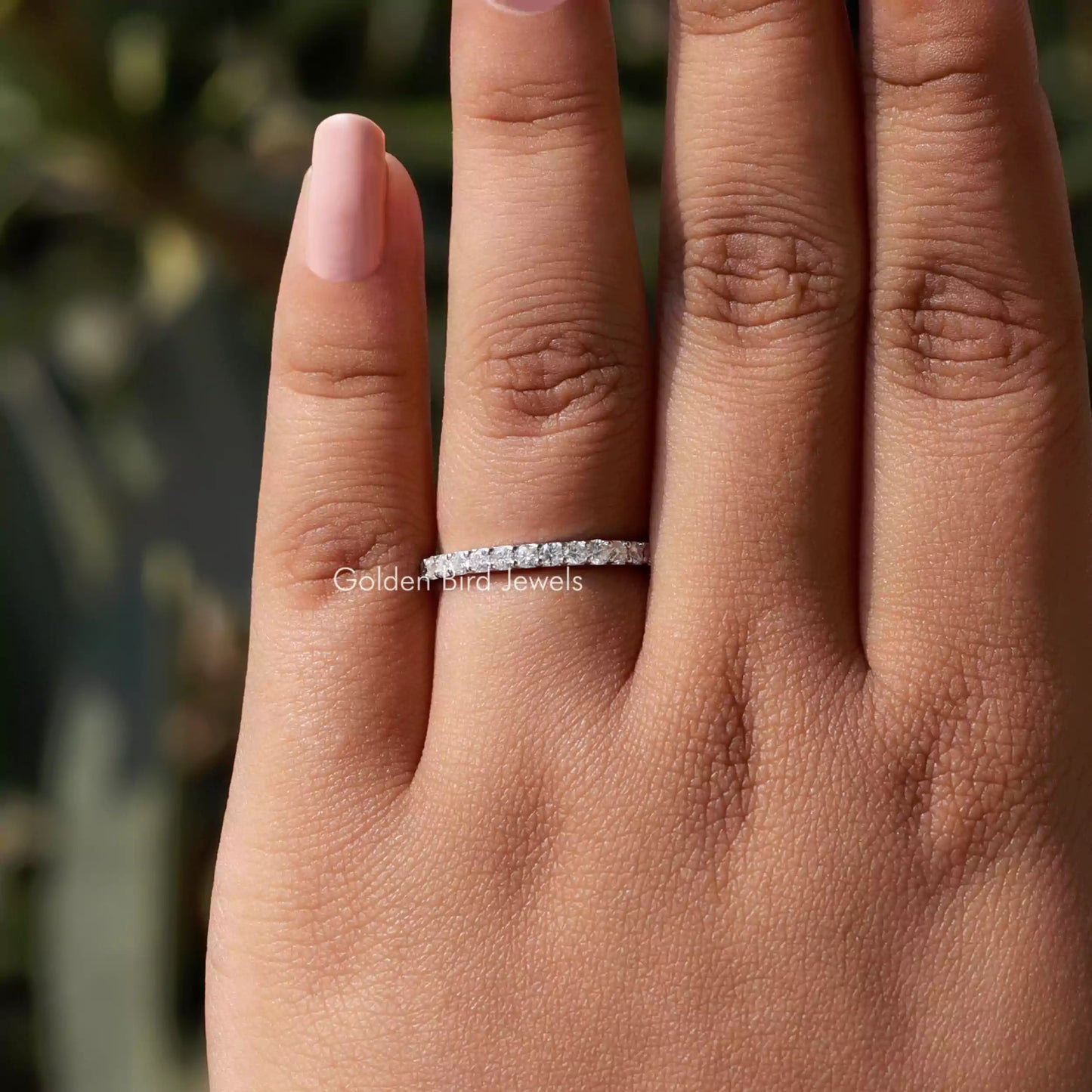 In finger view of Round Cut Moissanite Solitaire Ring