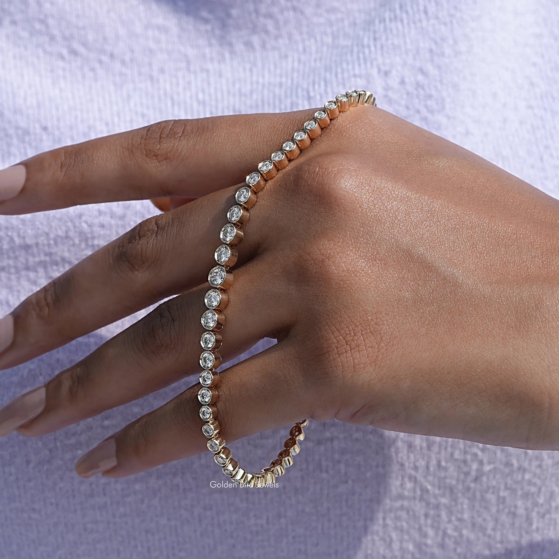 In hand showing view of moissanite round cut bracelet 