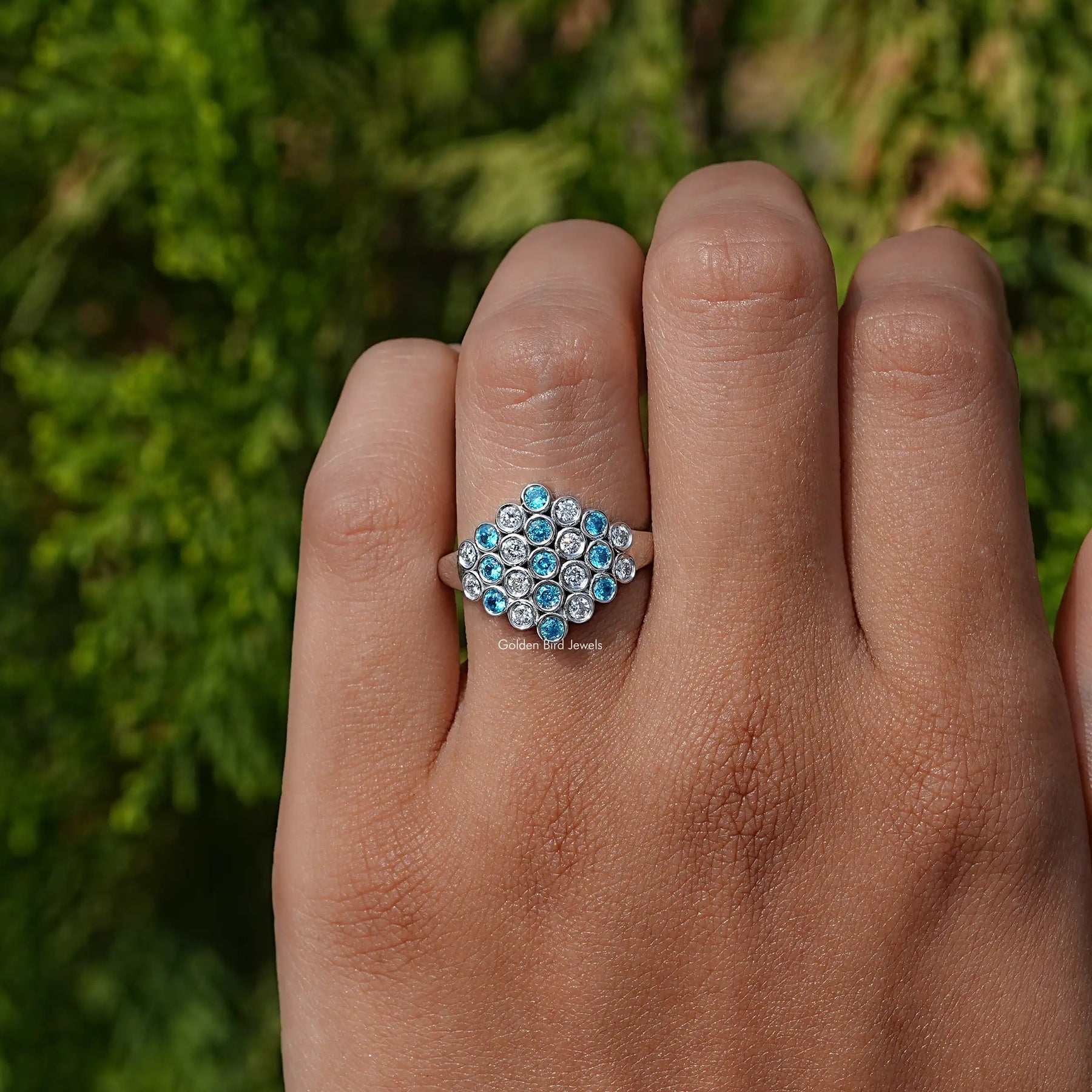 View of solitaire Paraiba lab diamond ring in prongs setting 