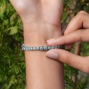 Side View Of Blue Round Cut Moissanite Tennis Bracelet