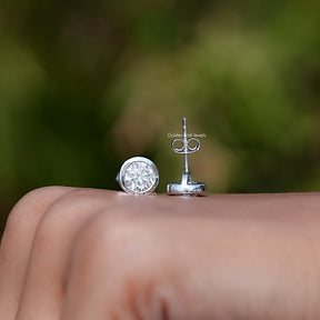 Front & back View of  Round Cut Bezel Set Stud Earrings In White Gold