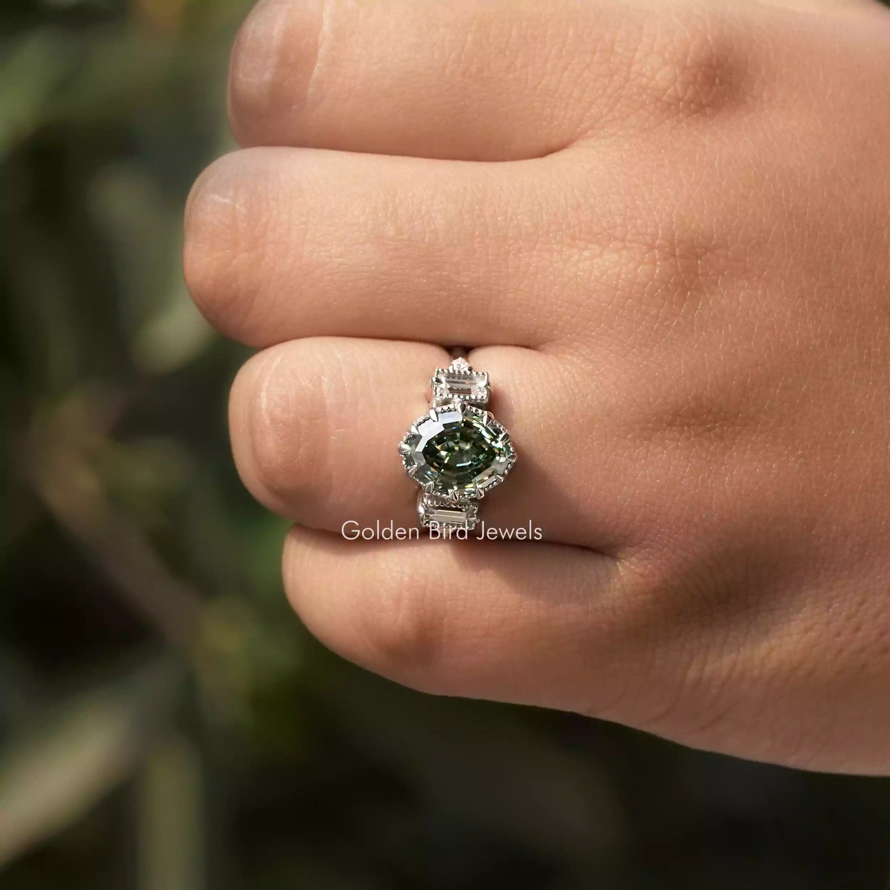Close-Up View of Oval And Baguette Cut Moissanite Engagement Ring In White Gold        