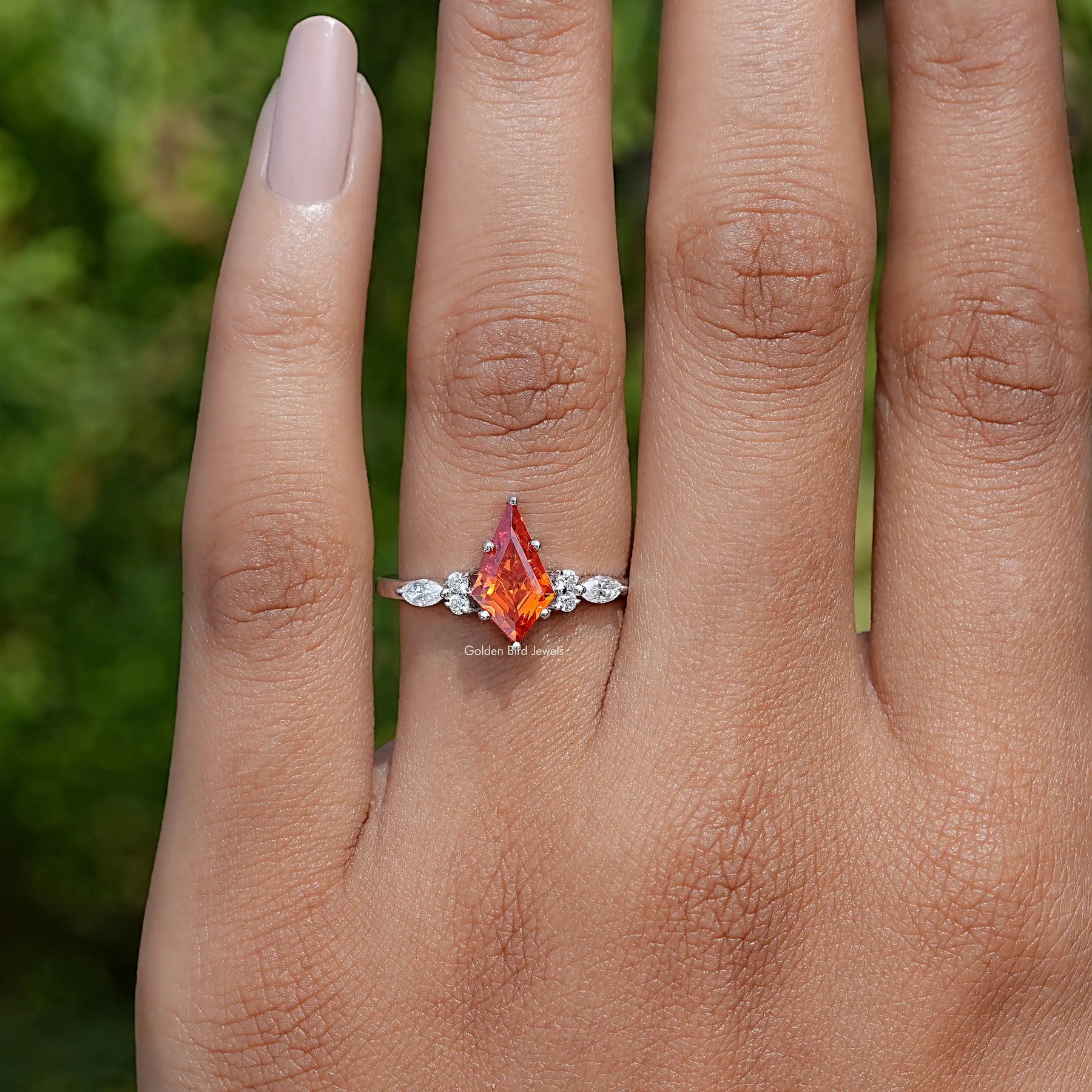 In Finger front view of Orange Kite Cut Gemstone Accent Engagement Ring In White Gold