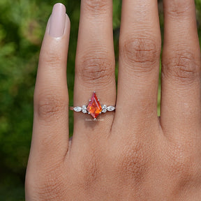 In Finger front view of Orange Kite Cut Gemstone Accent Engagement Ring In White Gold