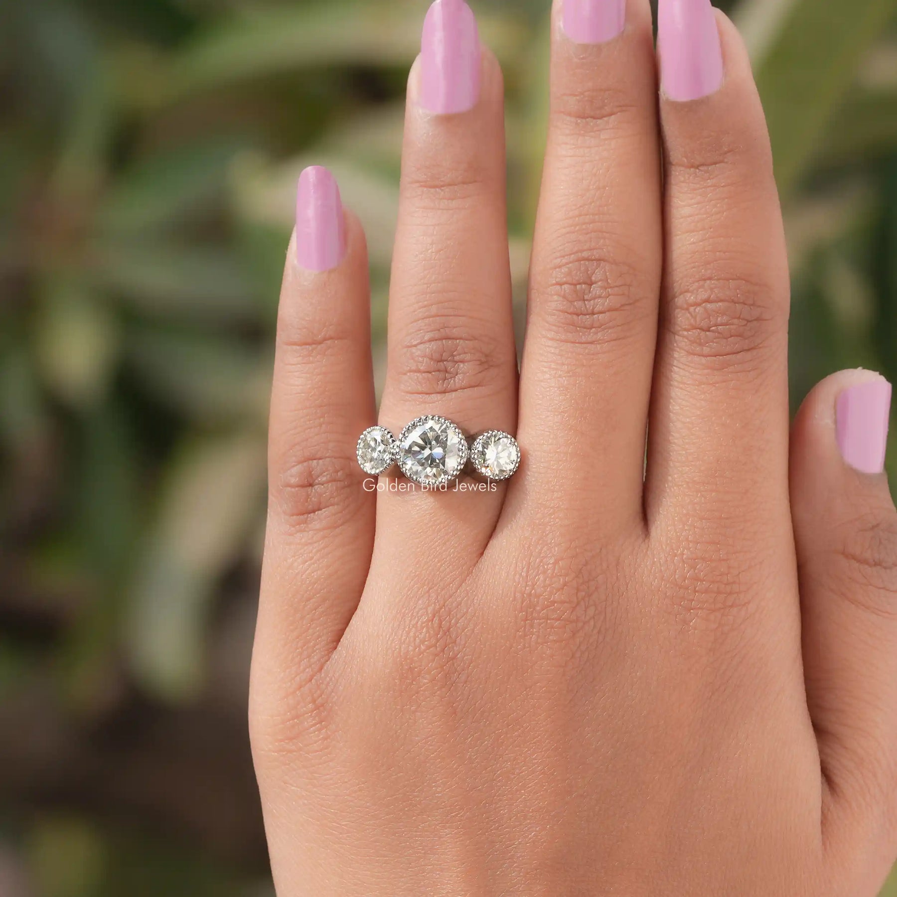 Detailed View Of Round Cut Moissanite 3 Stone Ring In Yellow Gold