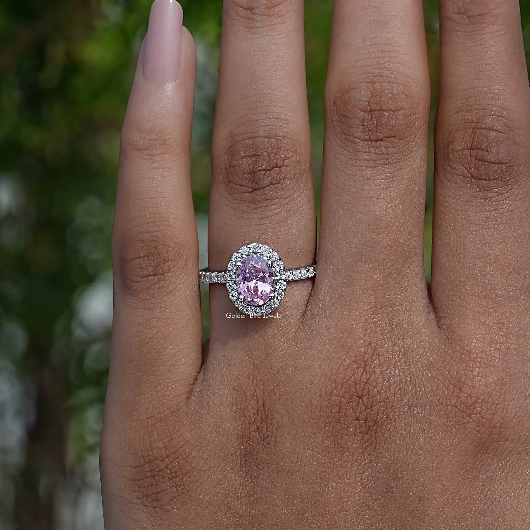 Detailed View Of Oval Cut Gemstone Halo Accent Ring