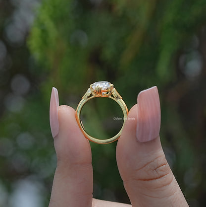 Marquise moissanite solitaire ring shown from the side, revealing the raised setting and slim band