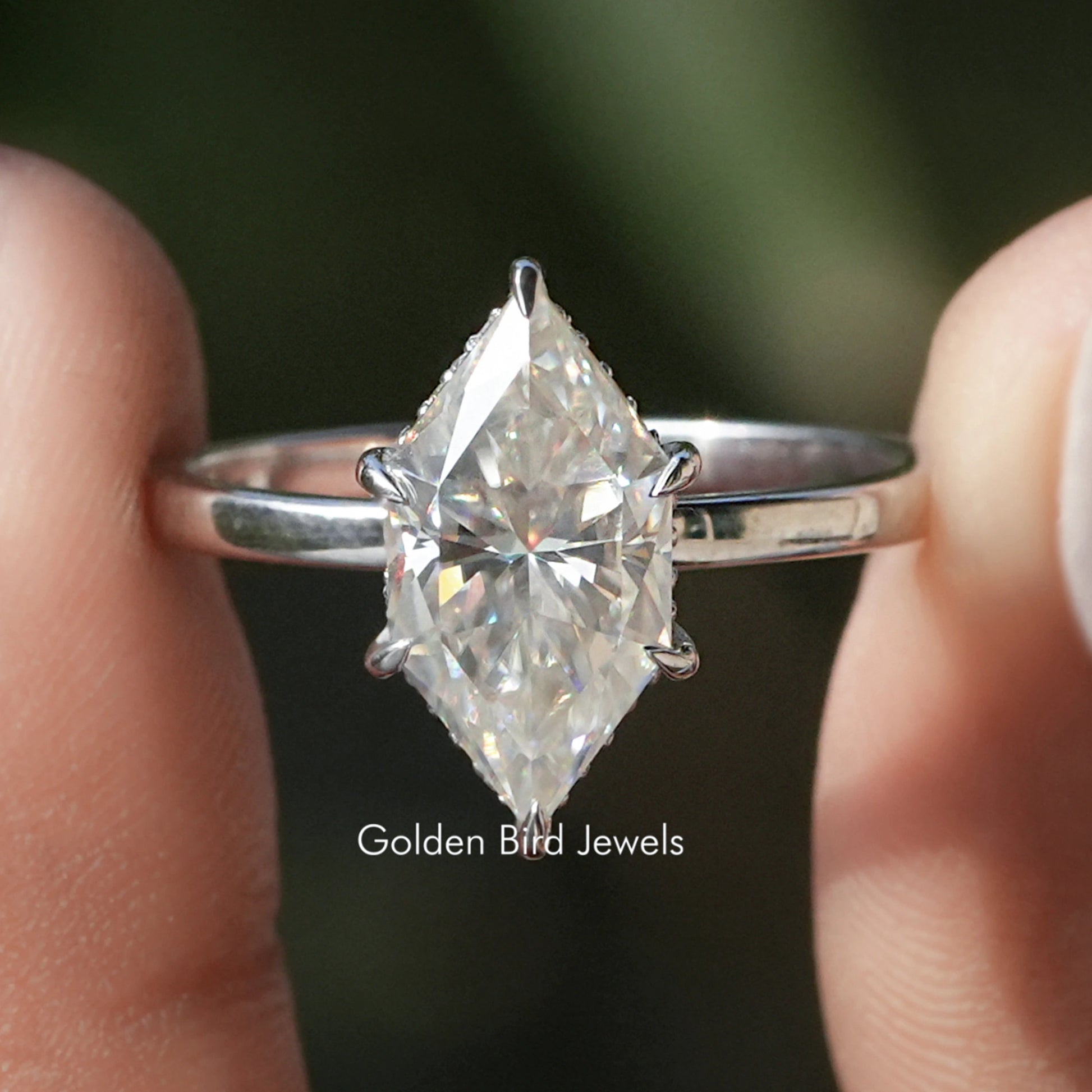 Front view of Dutch Marquise Cut Moissanite Hidden Halo Ring in two fingers 