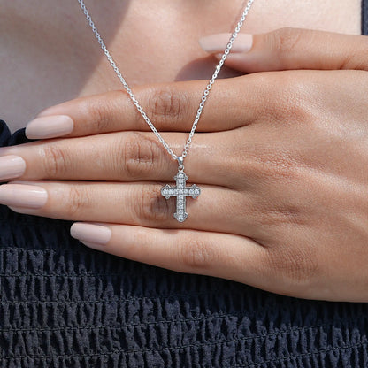 In Hand Showing View Of Round Cut Moissanite Encrusted Cross Pendant
