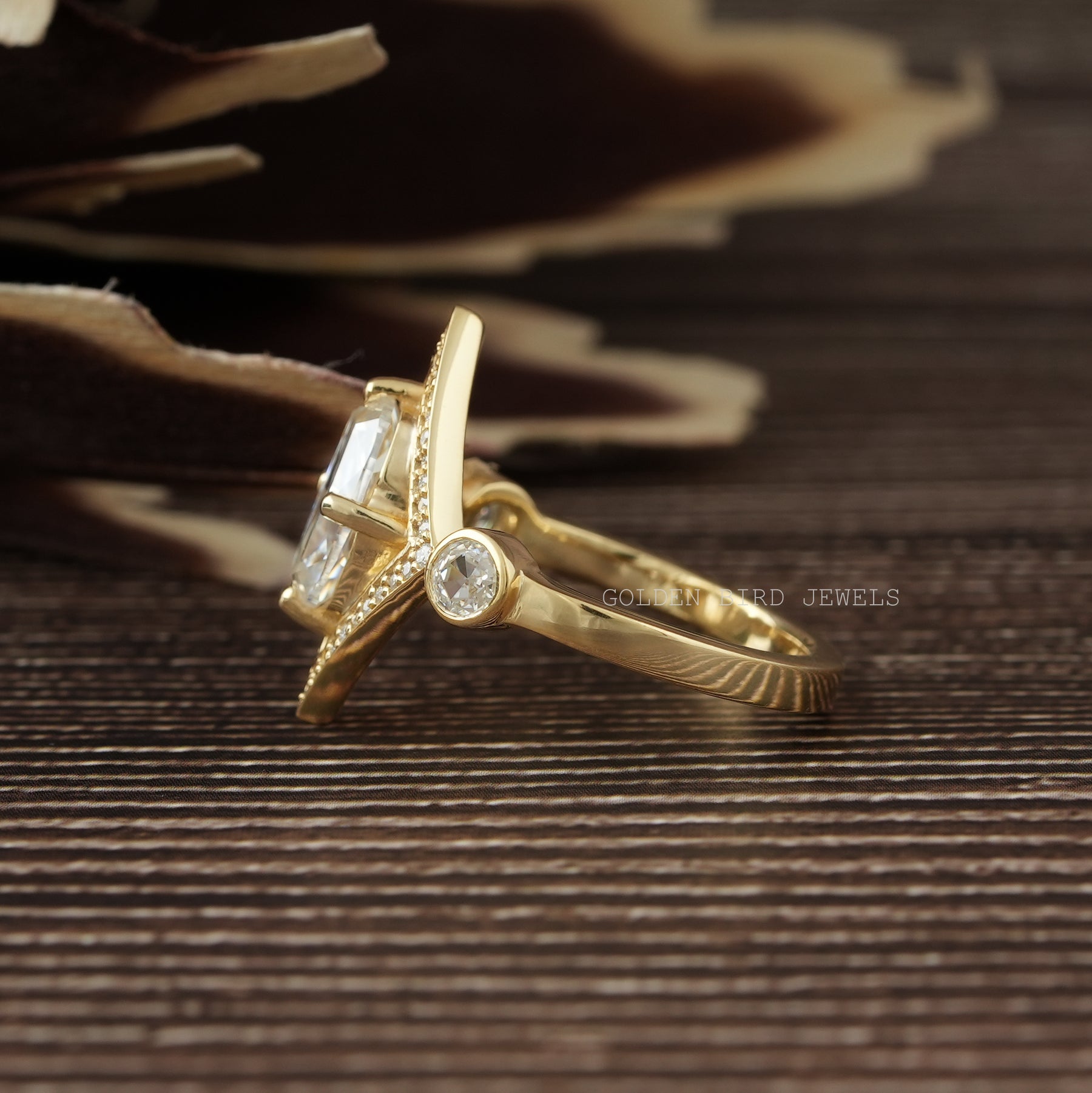 View of Round And Cushion Cut Moissanite Ring In Yellow Gold