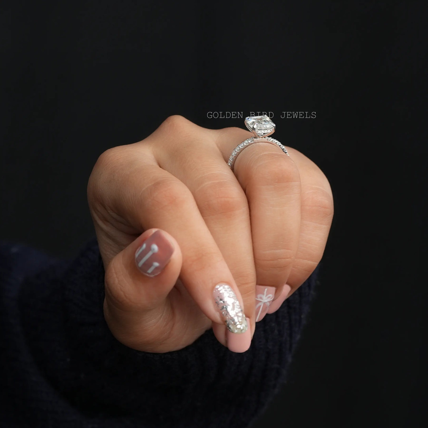 In Finger View Of Emerald And Round Cut Moissanite Solitaire Engagement Ring