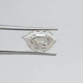 Tweezer holding the Lips Cut Moissanite Antique Loose Stone