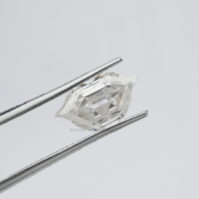 Front view of the tweezer Holding Antique Lips Loose Moissanite Stone In White color 
