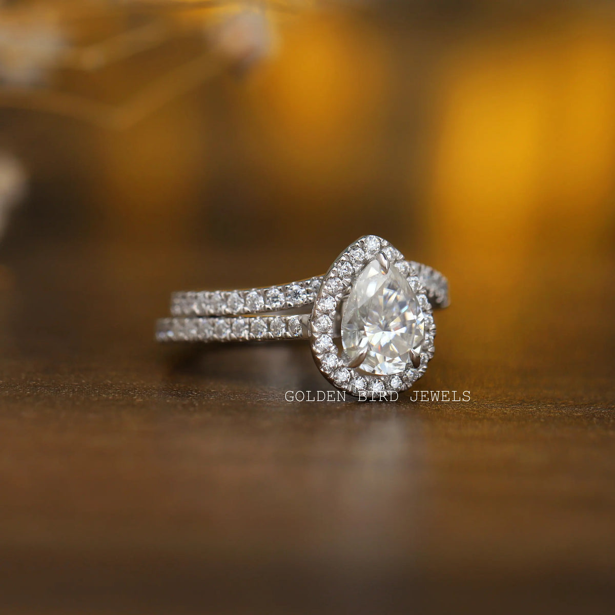 View of Pear And Round Cut Moissanite Engagement Ring In White Gold